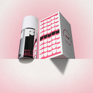 Perfume and box with 'Fumum' branding on a light pink background