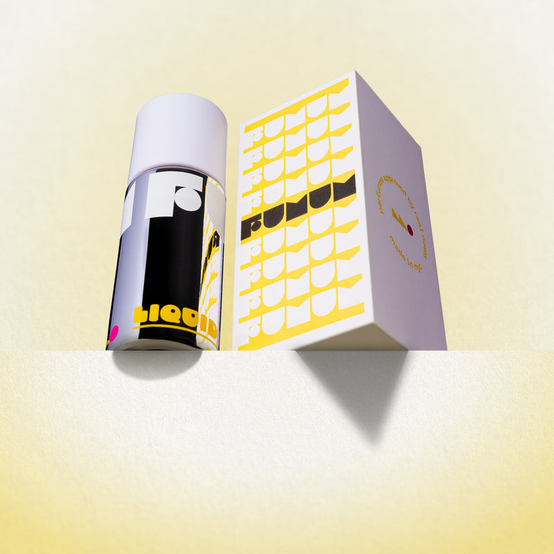 Perfume and box with 'Fumum' branding on a yellow background