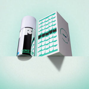Perfume and box with 'Fumum' branding on a light blue background