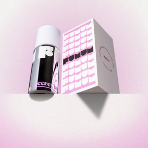 Perfume and box with 'Fumum' branding on a purple background